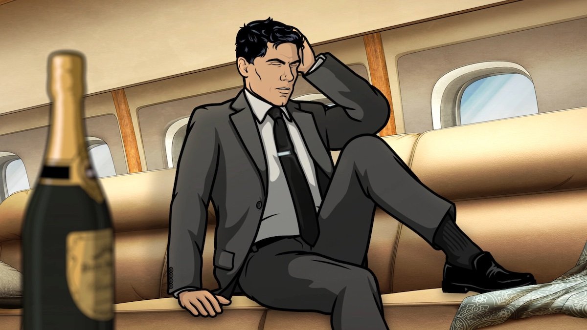 Hungover Archer with his hand on his head on a jet