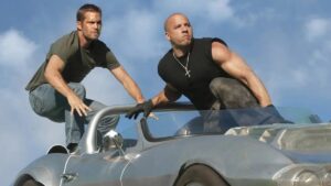 Brian and Dom atop a moving car in Fast Five
