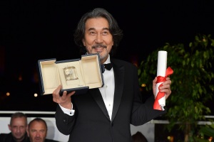 Kōji Yakusho poses with the Best Actor Award for 'Perfect Days'