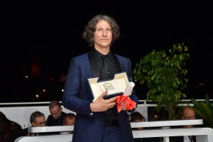 Jonathan Glazer poses with The Grand Prix Award for 'The Zone of Interest'