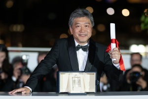 Hirokazu Kore-eda poses with the The Award for Best Screenplay for 'Kaibutsu' (Monster)