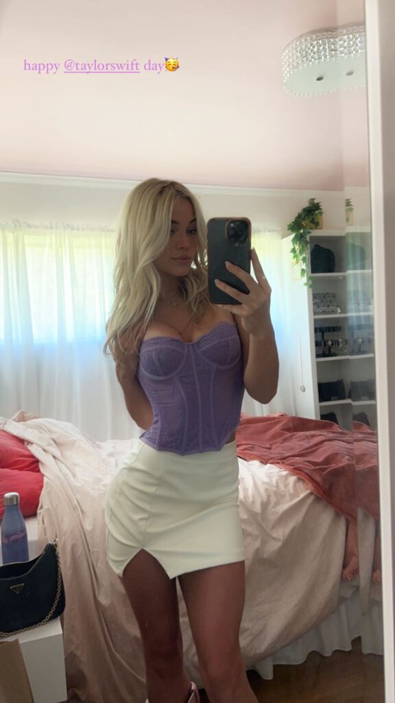 Olivia Dunne sizzles in a purple corset and white leather skirt