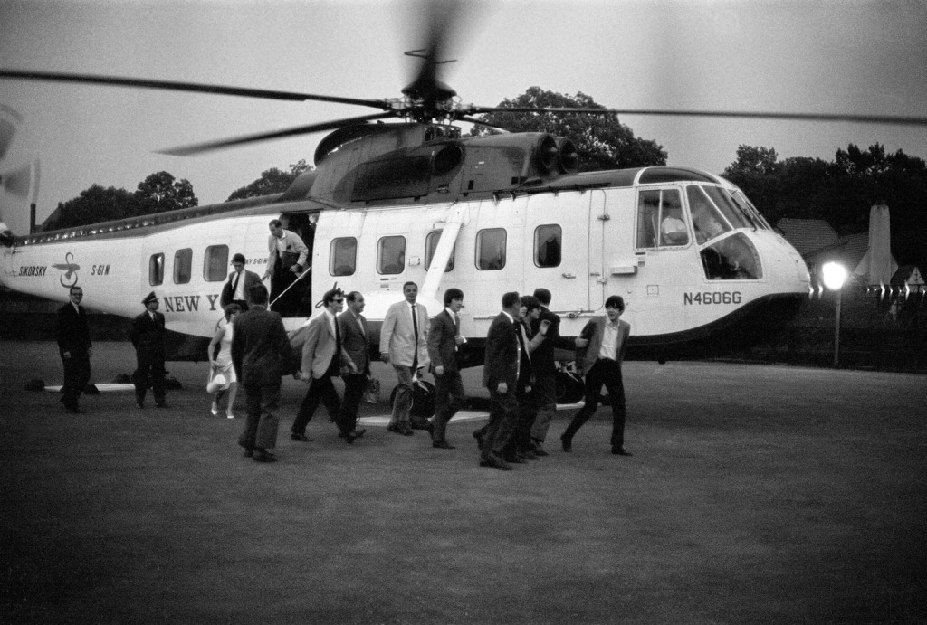 The Beatles landing in a helicopter at Forest Hills Stadium.