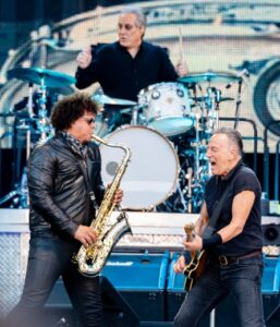 Springsteen, right, with saxophonist Jake Clemons and drummer Max Weinberg.