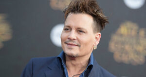 Johnny Depp says he's 'proud' of his 'rotting teeth' with 'loads of cavities'