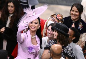 LONDON, ENGLAND - MAY 06: Katy Perry takes selfies with guests during the Coronation of King Charles III and Queen Camilla on May 06, 2023 in London, England. The Coronation of Charles III and his wife, Camilla, as King and Queen of the United Kingdom of Great Britain and Northern Ireland, and the other Commonwealth realms takes place at Westminster Abbey today. Charles acceded to the throne on 8 September 2022, upon the death of his mother, Elizabeth II. (Photo by Gareth Cattermole/Getty Images)