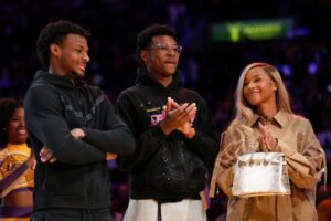 From left, Bronny, Bryce and Savannah James appear at a ceremony honoring LeBron James as the NBA's all-time leading scorer on Feb. 9 in Los Angeles.