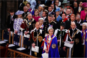 Tindall is pictured within the red circle at the coronation, where he was seated behind Prince Harry.