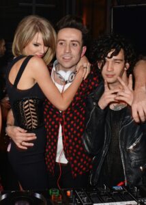 (L to R) Taylor Swift, Nick Grimshaw, and Matt Healy attend the Universal Music Brits party on February 25, 2015, in London.