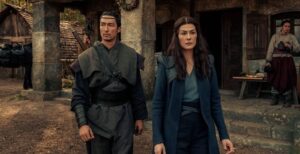 Rosamund Pike as Moiraine Damodred with Daniel Henney as al'Lan Mandragoran in The Wheel of Time