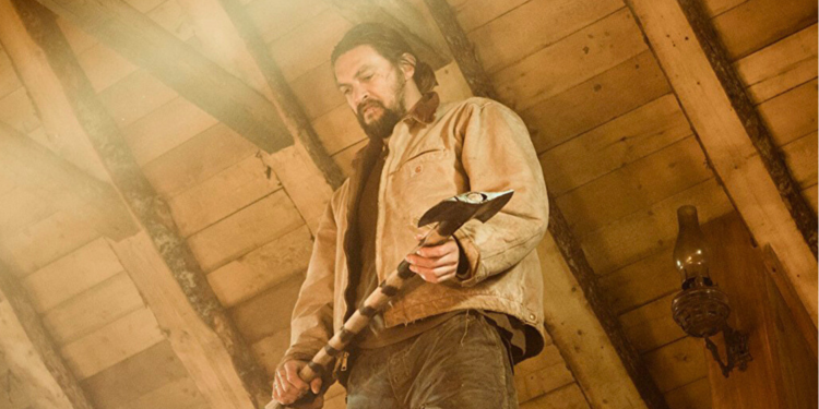 Jason Momoa best movie roles - holding an axe in Film Braven. 