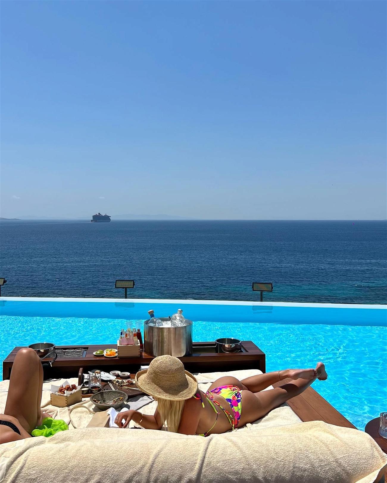 TikTok Star Alix Earle Sunbathes In Greece In A Colorful Bikini