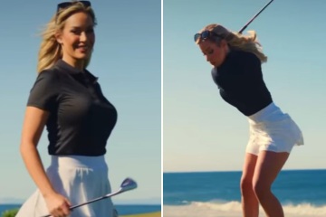 Paige risks wardrobe malfunction 
in short skirt on breezy golf course