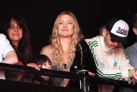 Kate Hudson, centre, watches Lil Nas X perform.