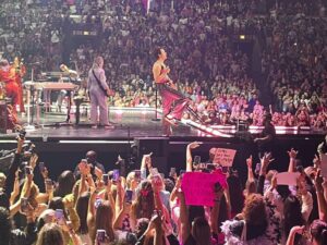 Styles performs as his fans try to get his attention with homemade signs at a Chicago show in October.