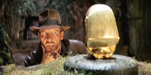 Indiana Jones contemplates the idol from Raiders of the Lost Ark