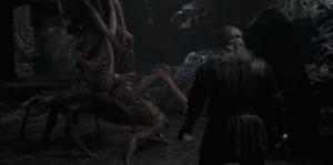 Geralt (Henry Cavill) staring down a flesh monster in a still from The Witcher season 3