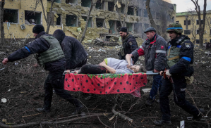 Irina, a pregnant woman, is carried away from a maternity hospital in Mariupol bombed by Russian forces.