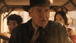 Indiana Jones in a vehicle in the Dial of Destiny
