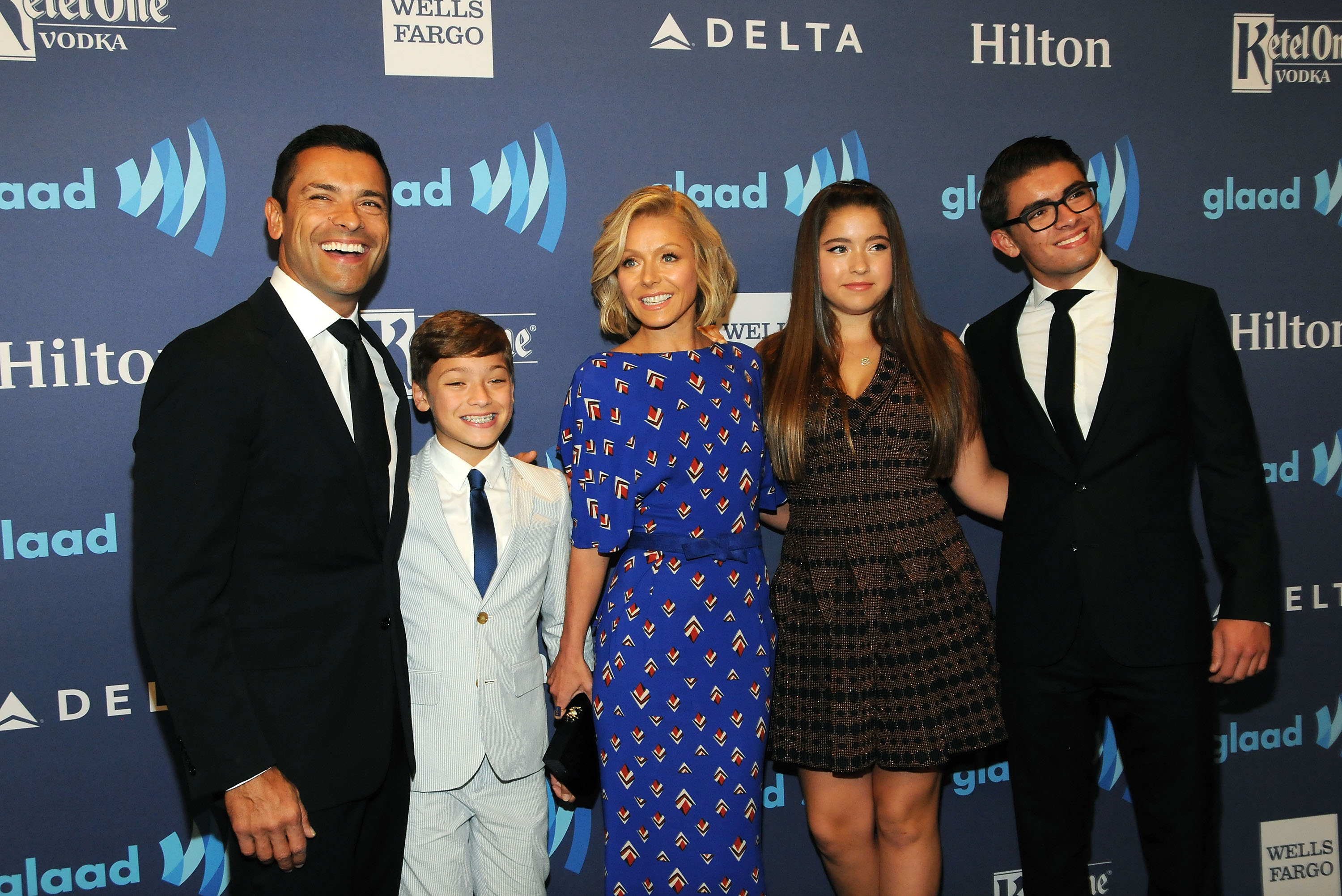 Mark Consuelos and Kelly pictured with Lola and their sons