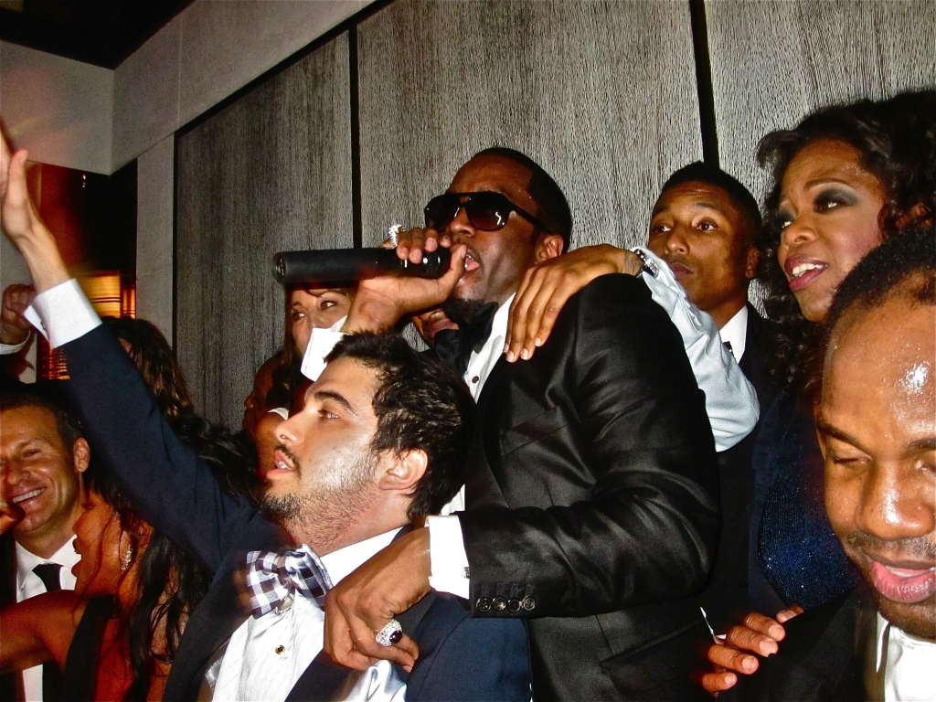 DJ Cassidy, Sean "Puffy" Combs, Pharrell Williams and Oprah Winfrey at a 2010 Met Gala after-party.