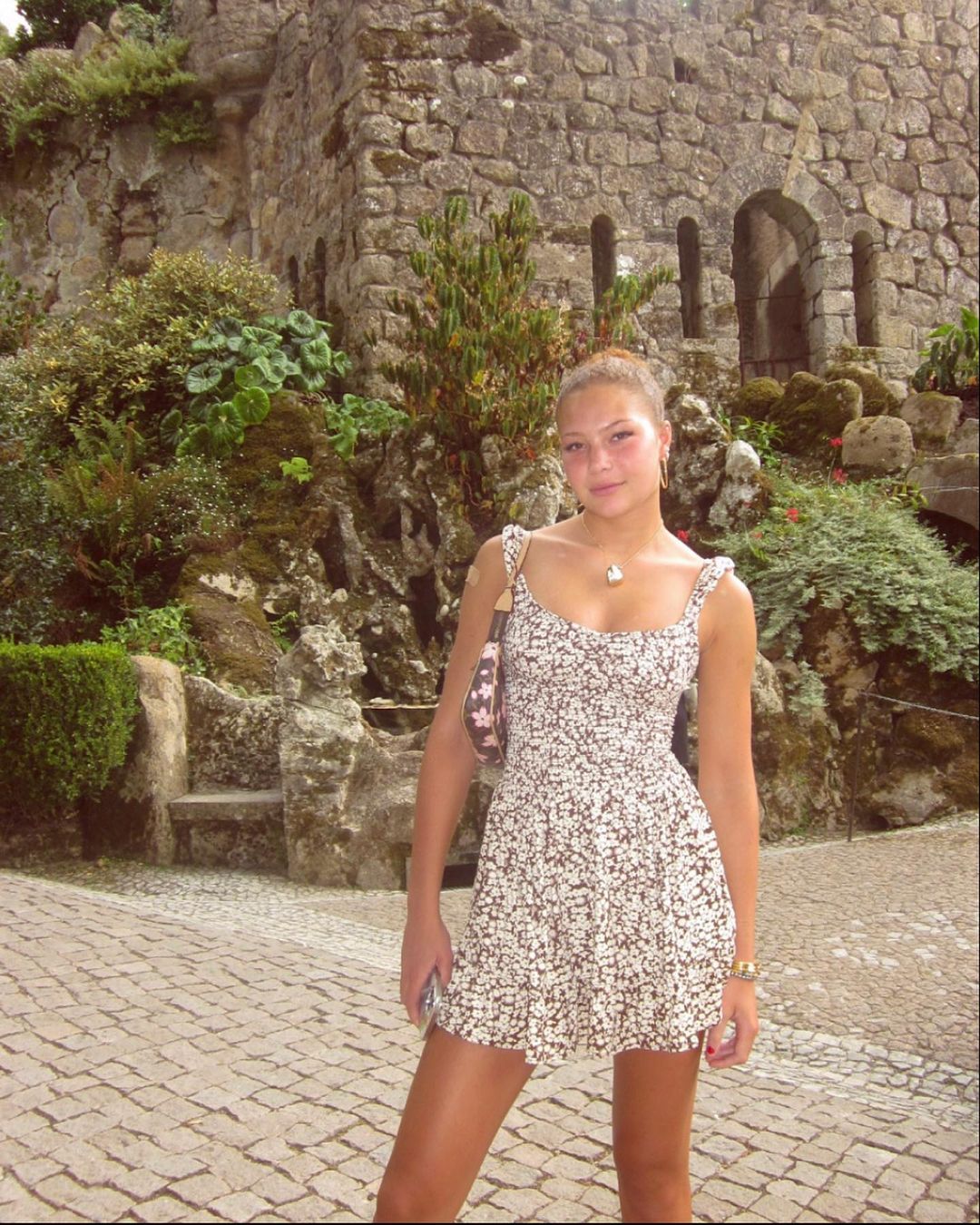 Isabella posed in front of the iconic sights in Sintra, Portugal while rocking her trendy attire and showing off her glowing skin