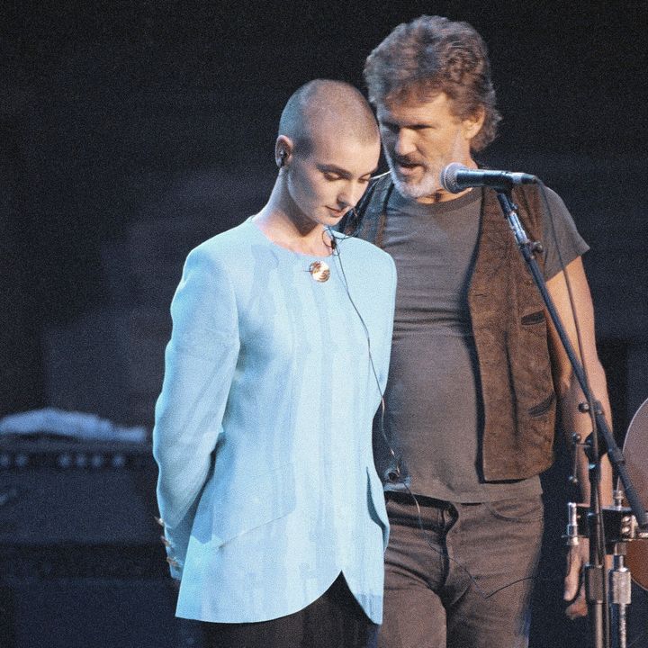 Singer Kris Kristofferson comforts O'Connor after she was booed offstage during a Bob Dylan anniversary concert at New York Madison Square Garden in 1992. The performance was O'Connor's first live event since she ripped a picture of Pope John Paul II during a performance on "SNL."