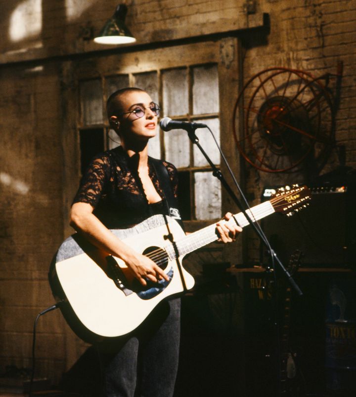 Sinead O'Connor performs on “Saturday Night Live” in 1990. During her second appearance on the show, in 1992, she caused an uproar after tearing up a photo of Pope John Paul II. 