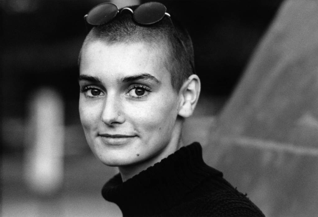 An image of Sinéad O'Connor smiling.