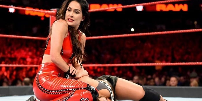 Brie Bella in an intense wrestling match