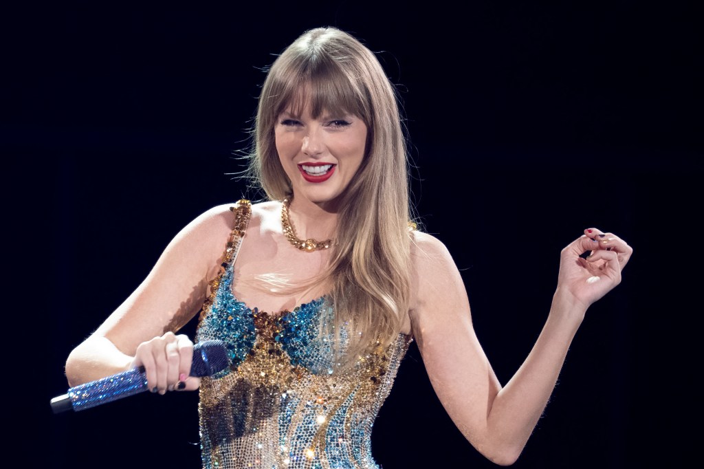 Taylor Swift dances in a rhinestone bodysuit on the Eras Tour.