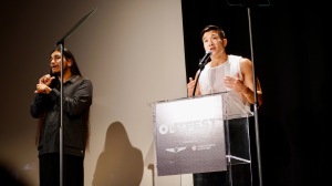 'Fire Island' actor-writer Joel Kim Booster at Outfest. To his right is a sign language interpreter.
