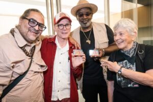 Aaron "Sharp" Goodstone, Charlie Ahearn, Fab 5 Freddy and photographer Martha Cooper getting their "Wild Style" library cards at the Schomburg Center for Research in Black Culture.