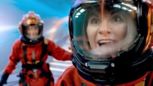 photo of the thirteenth doctor and yaz wearing orange spacesuits