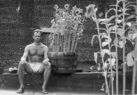 man next to plants