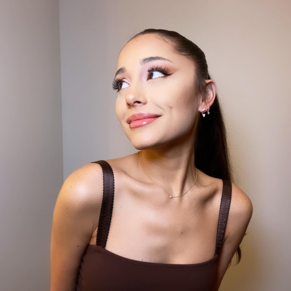 Ariana Grande poses with her signature ponytail in a close-up.