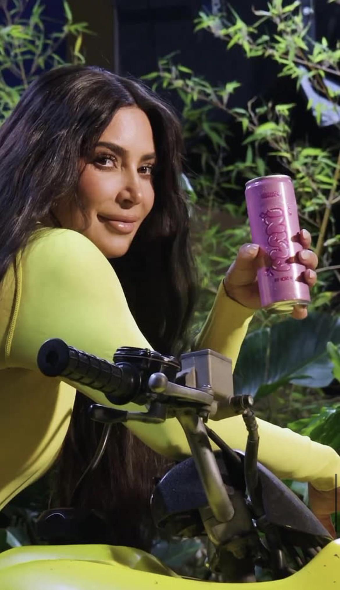 Kim donned a skintight yellow bodysuit while straddling a motorcycle in another eye-catching Alani ad