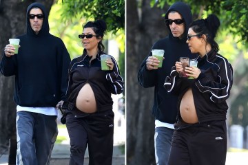 Kourtney's baby bump spills over unbuttoned jeans on stroll with Travis Barker