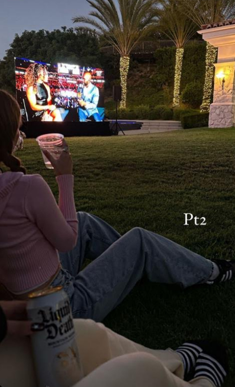 The 24-year-old shared several photos of them watching a boxing match while sprawled out on the lawn