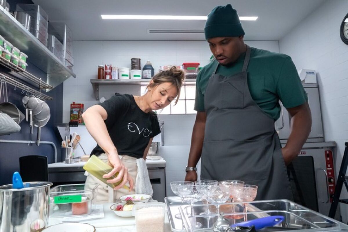 Courtney Storer and actor Lionel Boyce working on dishes for "The Bear." 