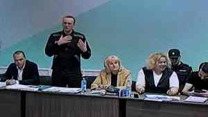 Russian opposition leader Alexei Navalny (2nd L) is seen on a screen during court hearings in the IK-6 penal colony at Melekhovo, about 250 kilometres (155 miles) east of Moscow, where he is jailed on June 19, 2023.