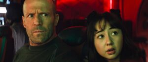 (L-r) Jason Statham as Jonas and Sophia Cai as Meiying look alarmed in Meg 2: The Trench.