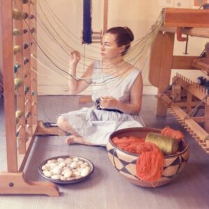 woman works with yarn