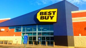 A Best Buy storefront with a blue sky in the background