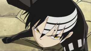 An image of Death the Kid in Soul Eater. You can see his hair cut, which has three white stripes on top.