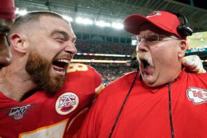 Travis Kelce and Kansas City Chiefs coach Andy Reid both holler in celebration while wearing game-day uniforms