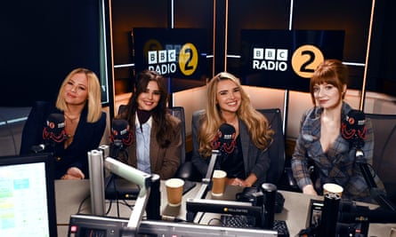 Girls Aloud members Kimberley, Cheryl (in polo neck and blazer), Nadine and Nicola (both wearing suits), announce their reunion in a BBC 2 studio. 