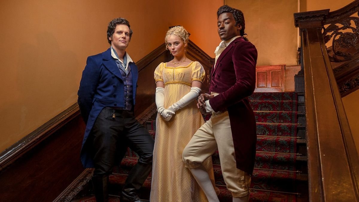 three people stand on stairs wearing regency era clothing in doctor who season 14 (season 1)