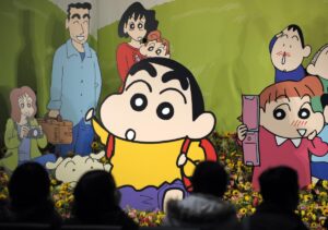 The anime character Shin-chan appears front and center in a memorial to his late creator, cartoonist Yoshito Usui