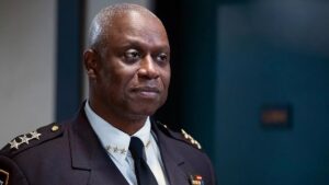 Andre Braugher as Captain Raymond Holt smiles while in uniform on Brooklyn Nine-Nine